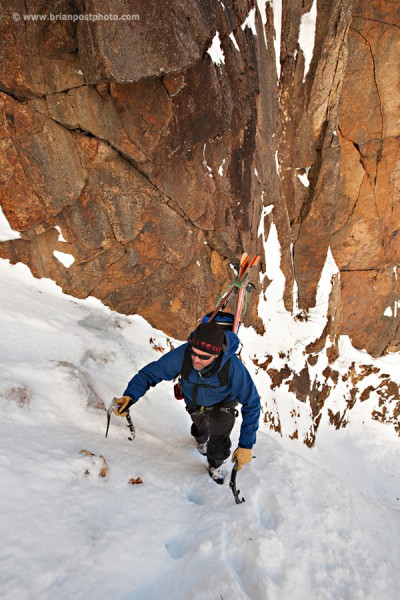 Jim Surette climbing the lower part of Shoestring Gully on Mount Webster for a ski descent. A complete descent without rappel was made thanks to recent storms that loaded the gully with deep snow.