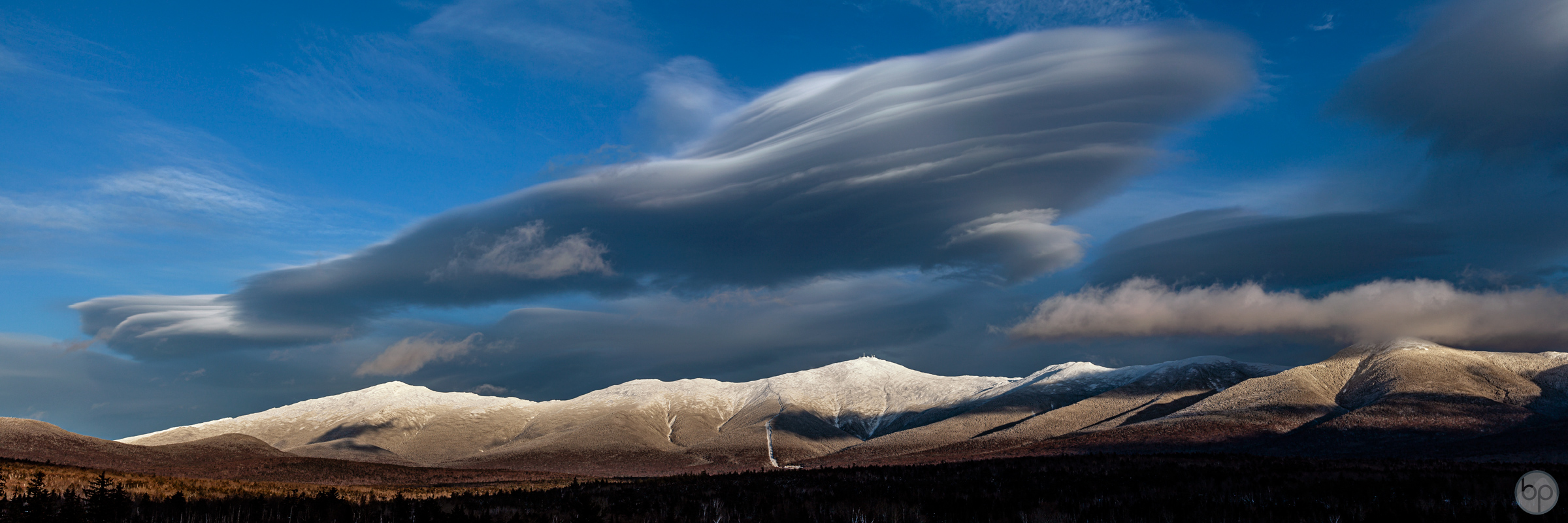 View of the west side of Mount Washington and the Presidential Range with lenticular clouds.
